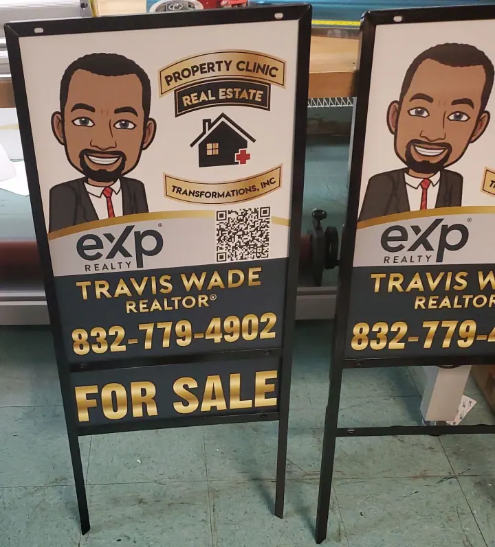 Two freestanding real estate For Sale signs