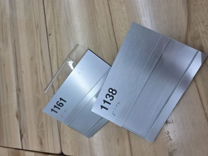 Brushed metal office room number signs
