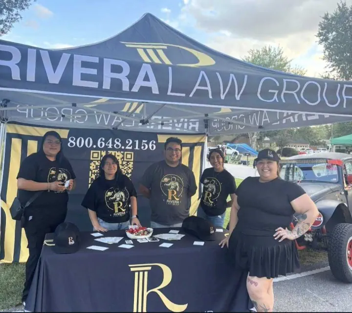 Rivera Law Group branded tent at an outdoor event