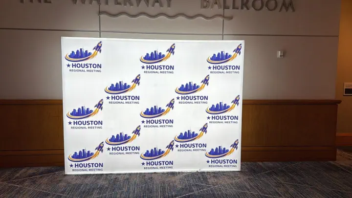 Houston themed branded photo backdrop at an event