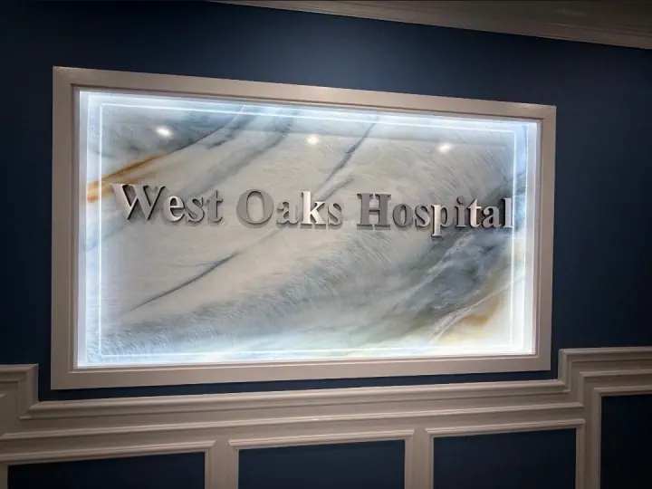 West Oaks Hospital exterior sign at night