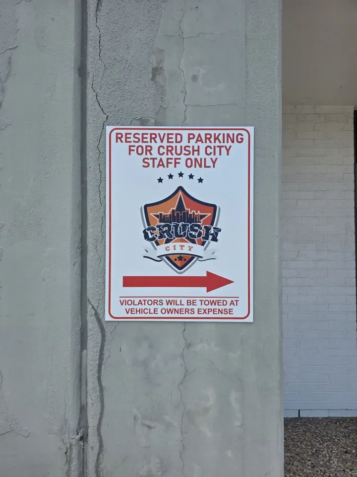 Reserved Parking sign on a concrete wall