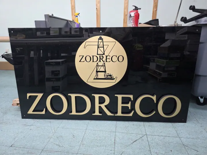 ZODRECO gold lettering on a black reception counter
