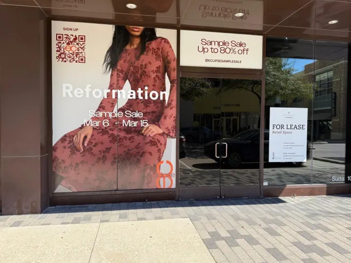 Reformation sale graphics covering storefront windows