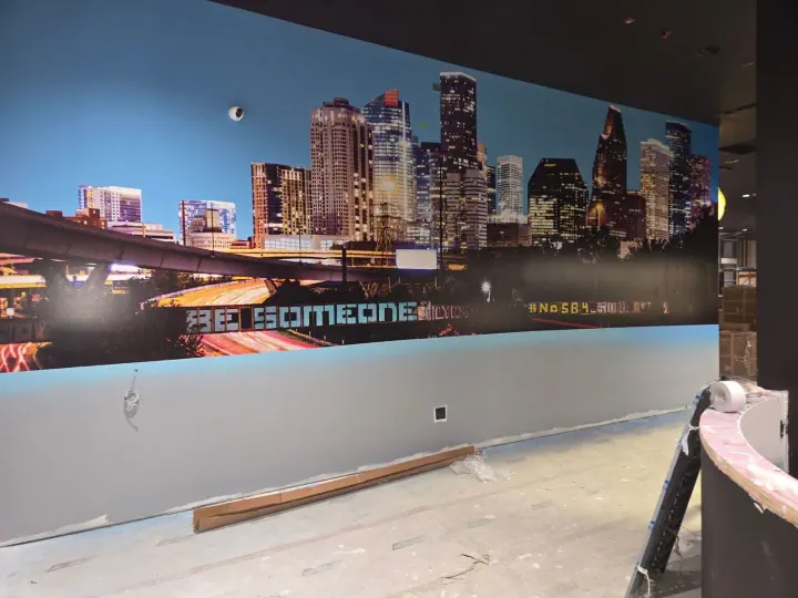 Houston skyline mural across an interior wall