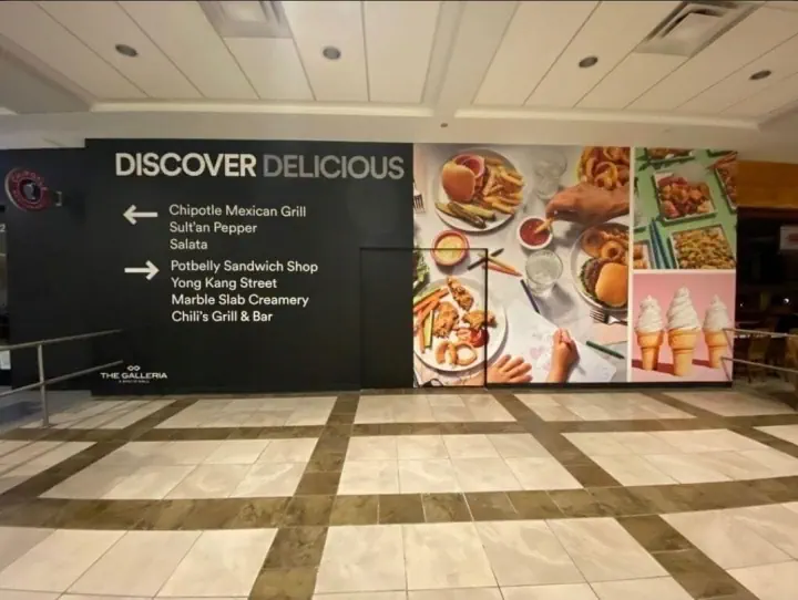 Colorful restaurant food mural across an interior wall