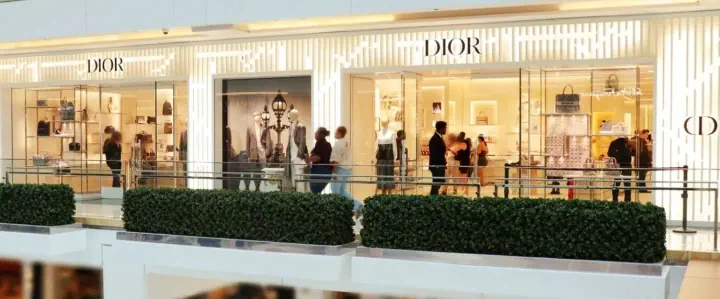 Dior illuminated storefront sign in a shopping mall