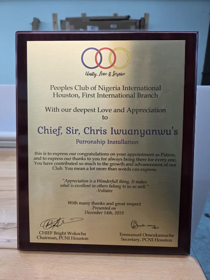 Framed appreciation plaque on a worktable