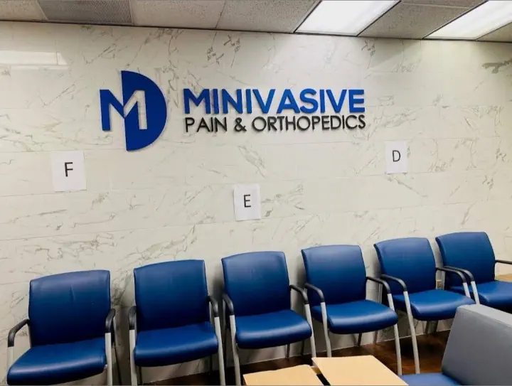 MINIVASIVE Pain & Orthopedics dimensional logo in a waiting room