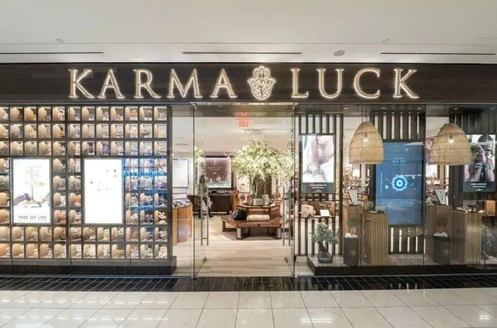 Karma Luck illuminated storefront sign in a shopping mall