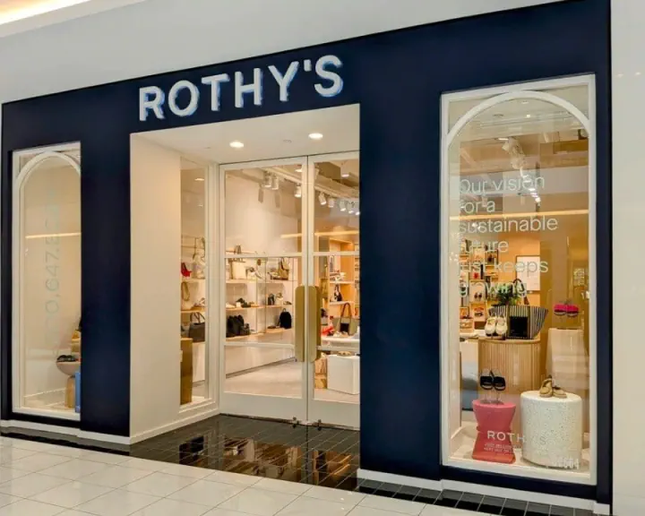 Rothy's illuminated storefront sign in a shopping mall