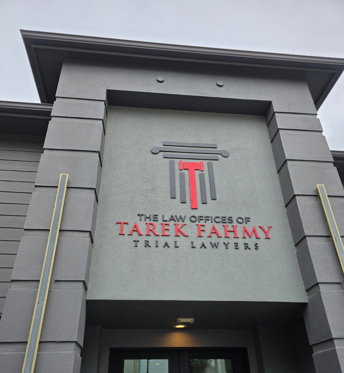 Dimensional building sign with logo on a law office facade